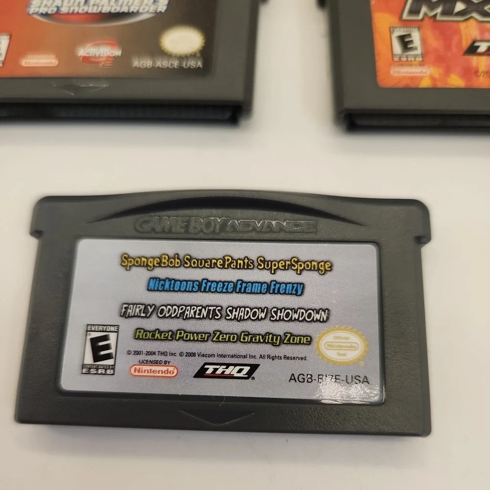 MX 2002 - Nintendo Game Boy Advance SpongeBob Shaun Palmers 2 cases lot of 3